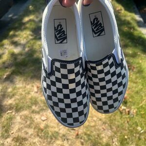 Platform Vans Black and White Checkerboard Slip-On Sneakers